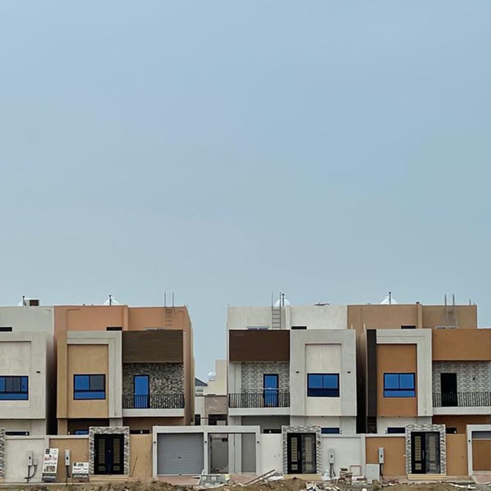 A low angle shot of a modern building with glass windows