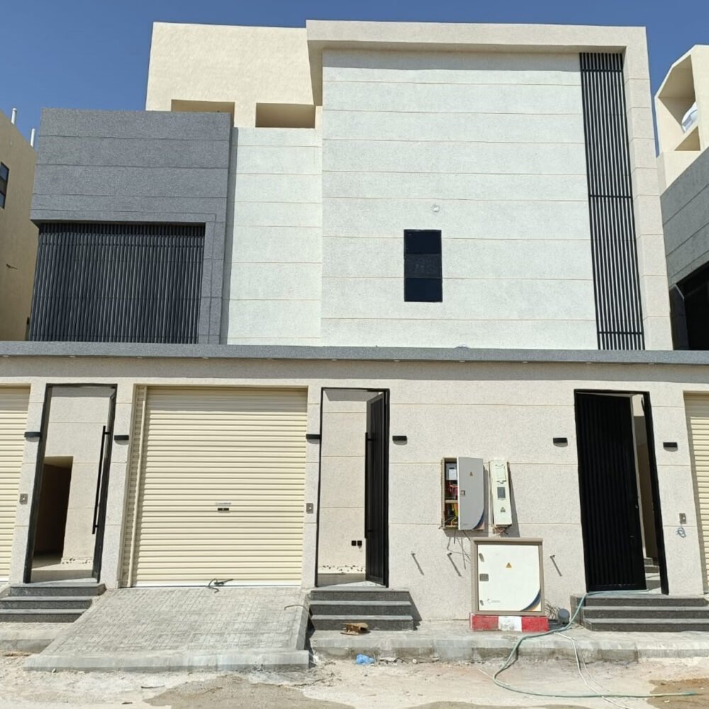 A low angle shot of a modern building with glass windows