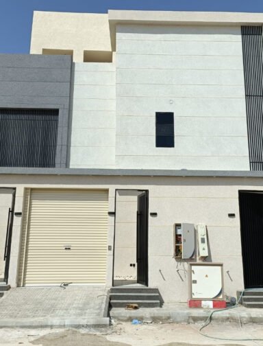 A low angle shot of a modern building with glass windows