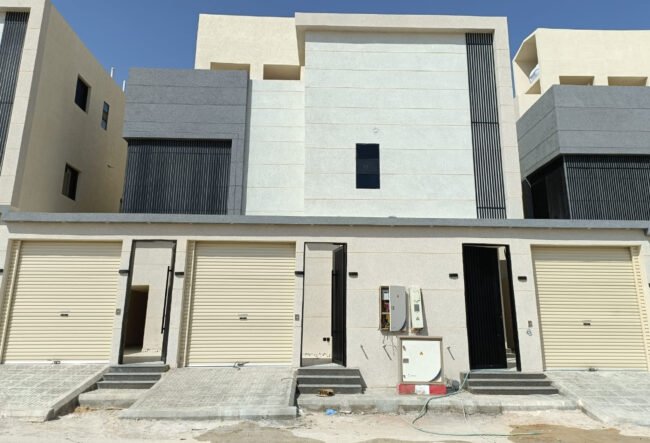 A low angle shot of a modern building with glass windows